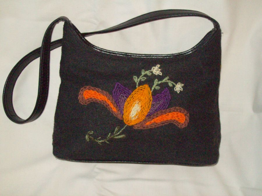 Black bag with embroidered flower motif